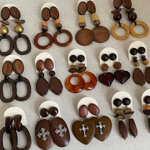 Assorted vintage wooden earrings in diverse geometric shapes with heart and cross motifs