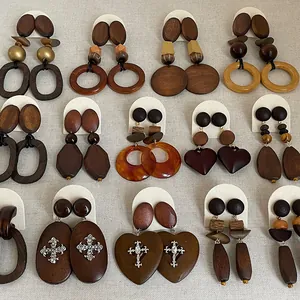 Assorted vintage wooden drop earrings featuring geometric heart and cross accents