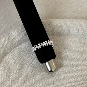 Detailed view of silver French style lace openwork ring featuring delicate metal beads