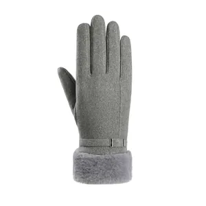 Detailed view of grey thermal glove with faux fur cuff and decorative wrist buckle
