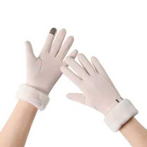 Detail of beige winter thermal gloves with faux fur cuffs and touchscreen fingertips.
