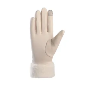 Detail of beige thermal gloves featuring soft faux fur cuff and touchscreen index finger