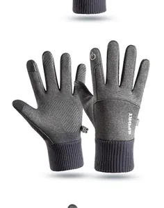 Detailed macro shot of grey winter sports gloves with touch screen and anti-slip features