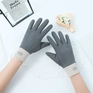 Close-up view of elegant gray and beige Dralon warm gloves with white decorative stitching