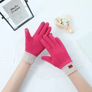 Detail of pink touchscreen gloves for women featuring warm Dralon fleece material
