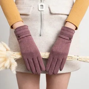 Detailed view of mauve thermal winter gloves for women featuring decorative wrist buttons.