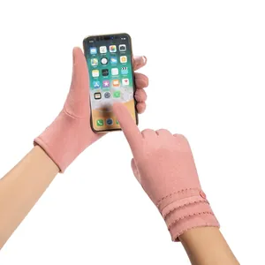 Detailed view of pink touchscreen gloves for women featuring warm plush lining