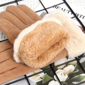 Detail of thick fleece lining and suede material of winter touchscreen gloves