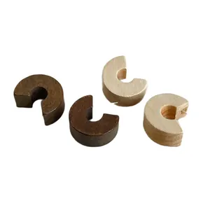 Chunky retro C-shaped wooden stud earrings in natural brown and tan wood textures.