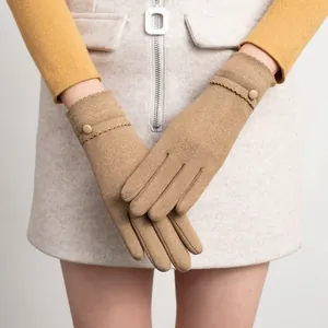 Close-up detail of women's thermal winter gloves featuring scalloped edges and decorative button