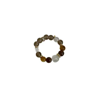 Minimalist tiger's eye and crystal beaded elastic ring with a gold rhinestone accent bead