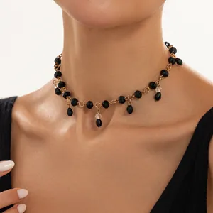 Detailed close-up of a retro black crystal beaded choker with water drop tassels.