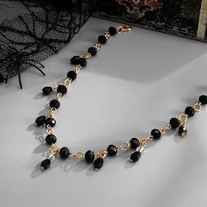 Close-up of black crystal beaded necklace with teardrop fringe in Gothic style