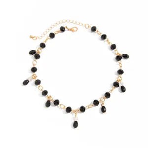 Detailed view of dark gothic style black crystal beaded necklace with teardrop charms