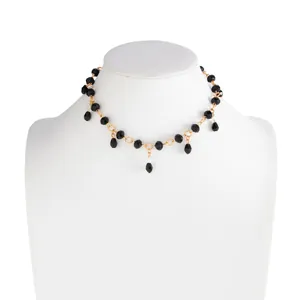 Detailed view of vintage black crystal beaded choker necklace with water-drop tassels