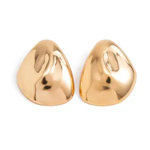 Detail view of large gold geometric waterdrop earrings with a polished mirror finish