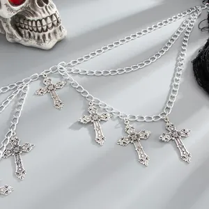 Close-up detail of Gothic silver multi-layer body chain with ornate engraved cross pendants