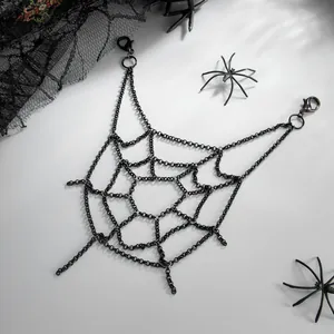 Detailed view of punk black metal spider web body chain for gothic Halloween costumes