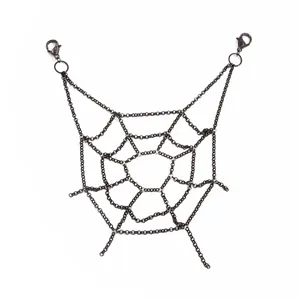 Close-up of black metal spiderweb chain in gothic punk style for body or pants jewelry