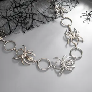 Macro view of a silver hip-hop style spider waist chain with geometric metal rings