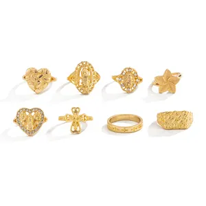 Detailed collection of 8 gold-plated rings featuring heart, cross, and religious designs