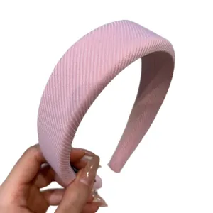 Classic pink padded headband with ribbed fabric for high cranial top effect