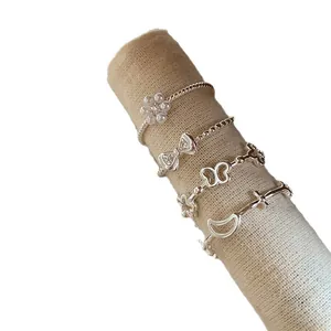 Exquisite silver-tone stackable ring set featuring sweet bow flower and butterfly charms