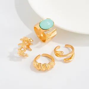 Set de anillos para dedos del pie dorados con gema turquesa y diseño de estrella de mar