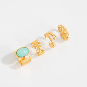 Elegante set de cuatro anillos para dedo del pie dorados con estrella de mar y turquesa