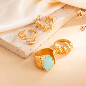 Juego de anillos ajustables dorados para los dedos del pie con estrella de mar y turquesa.