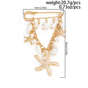 Dimensional details for gold starfish brooch featuring faux pearls and shell charms