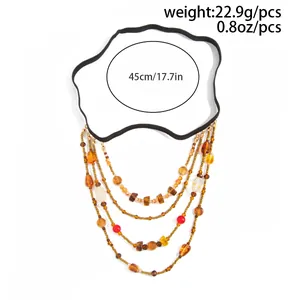 Detailed view of bohemian multi-layer beaded leg chain with elastic band and fringe