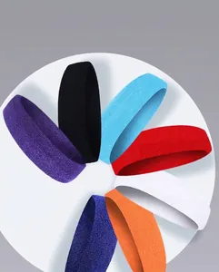 Detail of seven colorful elastic sports headbands for sweat-wicking during fitness.