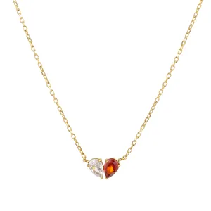 Gold heart-shaped birthstone necklace with clear and red teardrop cubic zirconia stones