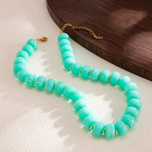 Macro view of bohemian mint green marbled resin beads with gold stainless steel spacers