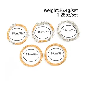 Detail view of 5-piece gold and silver bead bracelet set with size specifications.