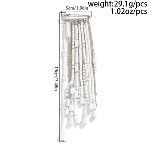 Detailed size and weight view of long white faux pearl tassel brooch with silver pin