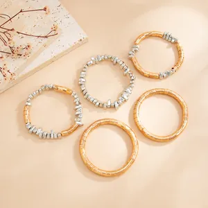 Mixed gold and silver metallic textured chokers showing exquisite stacking details.