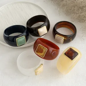 Retro chunky resin bangles set with marbled square detail for chic old money style
