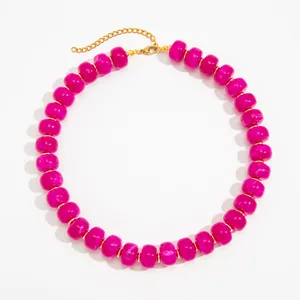 Close-up of magenta marble resin bead necklace with gold stainless steel chain