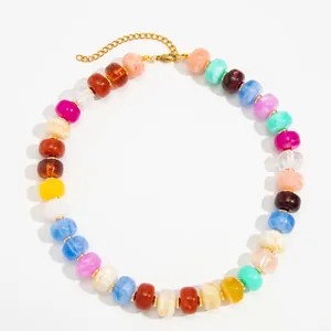 Vibrant bohemian necklace with colorful marbled resin beads and gold-tone chain detail