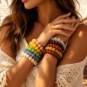 Bohemian style colorful resin beaded bracelet set displayed on a model in bright sunlight
