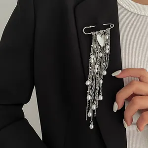 Elegant silver safety pin brooch with heart pendant and faux pearl tassel chains