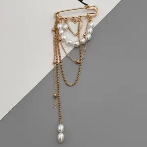 Elegant gold-tone heart and faux pearl multi-chain brooch pin for women.