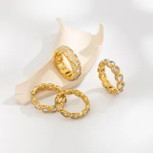 Close-up detail of 18K gold plated stainless steel rings featuring zircon stone settings.