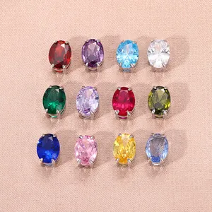 Set di 12 ciondoli ovali con zirconi colorati e montature in acciaio inossidabile