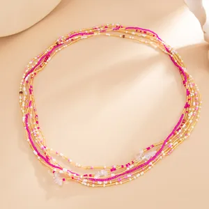Squisita catena elastica da corpo bohémien in perline rosa e oro per la spiaggia