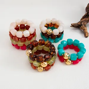 Braccialetti in resina marmorizzata stile Maillard con perline dorate