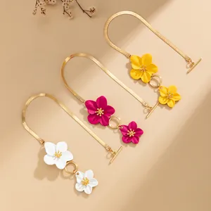 Macro detail of colorful enamel flower anklets with gold snake chain and OT clasp