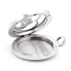 Detailed view of an open stainless steel cross hollow essential oil diffuser locket.
